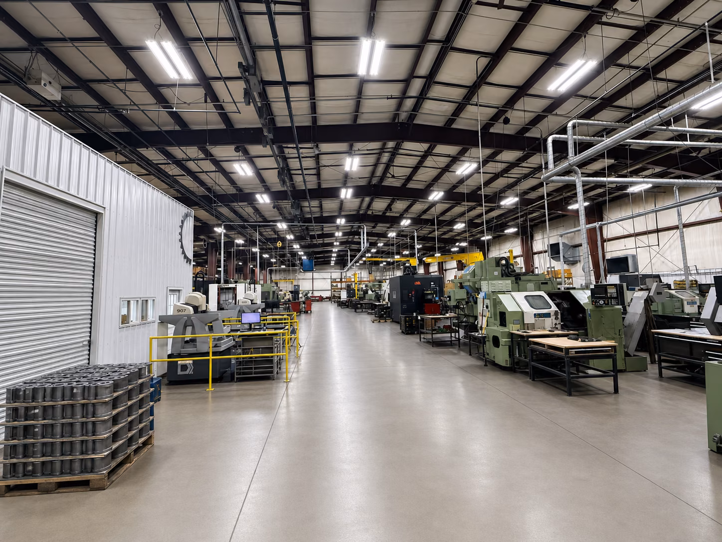 Clean, organized production aisle inside Accurate Gear & Machine